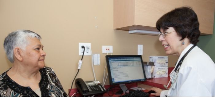 patient with provider in front of computer screen